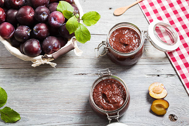 Homemade plum jam on wooden board