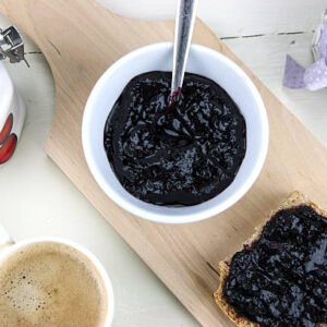 Homemade blueberry jam with integral bread and coffe